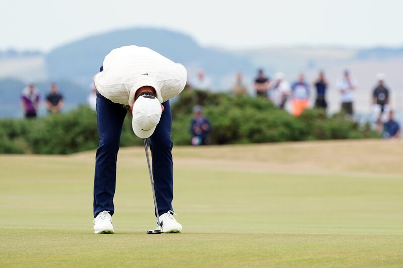 Rory McIlroy reacts after missing a putt on the 6th green. PA