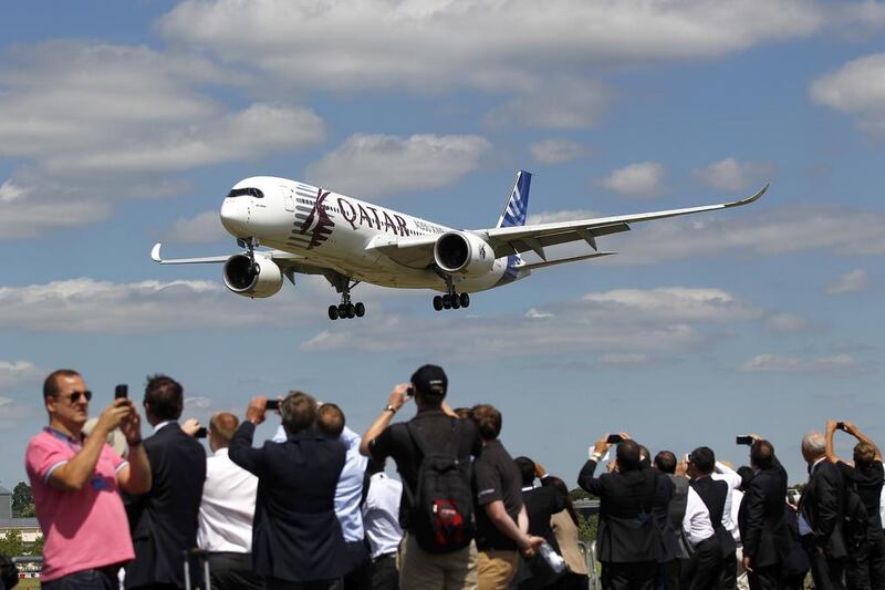 An Airbus A350 in Qatar Airways livery prepares to land after performing in an aerial flying display on the Farnborough International Airshow in July. Paul Thomas / Bloomberg News