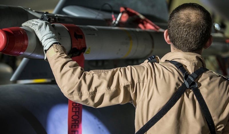 A British Royal Air Force Tornado pilot checking the weapons on his Tornado aircfraft at RAF Akrotiri, Cyprus. AP Photo