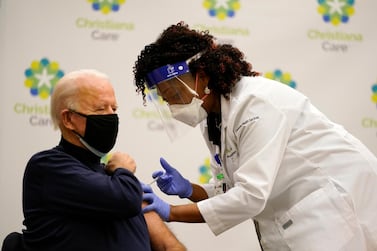 President-elect Joe Biden receives his first dose of the coronavirus vaccine from nurse practitioner Tabe Mase on December 21. AP