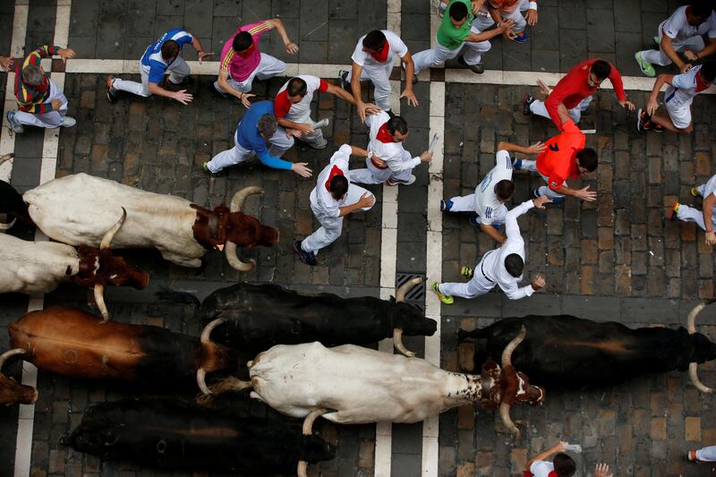 The fast-paced running of the bulls left two people injured at Spain's San Fermin festival on Monday. Susana Vera / Reuters