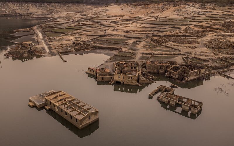 Houses of the former village of Aceredo, in Galicia, Spain. The village was buried under water due to the construction of a reservoir in 1992, yet in 2021 the village resurfaced due to a drought. EPA