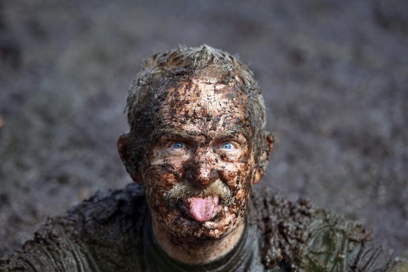 A male entrant takes a dip in the Bog Jacuzzi after participating in the Irish Bog Snorkelling championship on Sunday. Charles McQuillan / Getty Images 