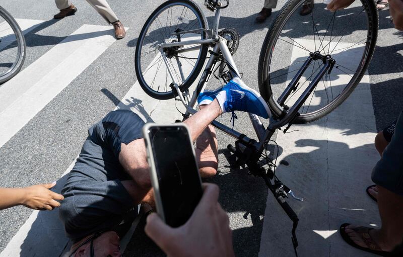 Mr Biden after falling from his bike. AFP