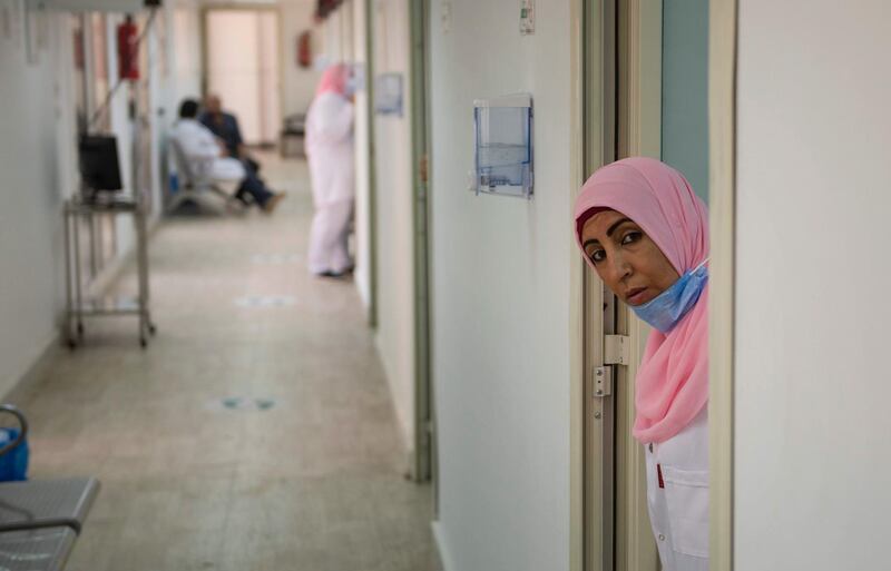 A nurse waits for volunteers after Egypt's Health and Population Ministry announced that it would start to open volunteer registration for the third phase of the coronavirus vaccine clinical trials, in cooperation with the Chinese government and the UAE health care company G42, in Cairo, Egypt.  EPA