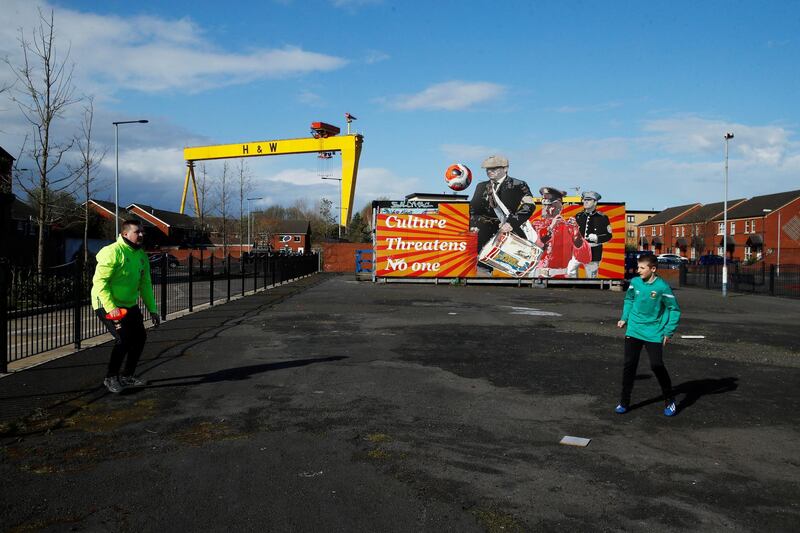 Rylan (12) playing football with his uncle Aaron, as the spread of the coronavirus disease (COVID-19) continues, Belfast, Northern Ireland. REUTERS