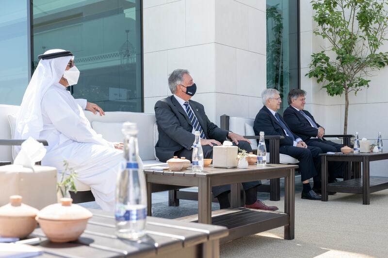 Ahmed Ali Al Sayegh, UAE Minister of State and Chairman of Abu Dhabi Global Market (L) attends a meeting with Luis Lacalle Pou (not shown), at Al Shati Palace.