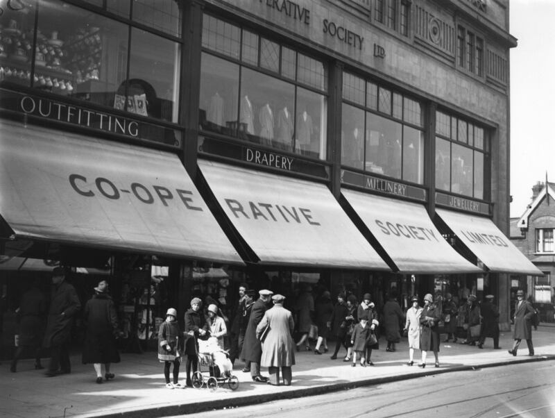 Shoppers outside the Co-Operative Society Ltd in East Ham, London, in 1929. All photos: Getty Images