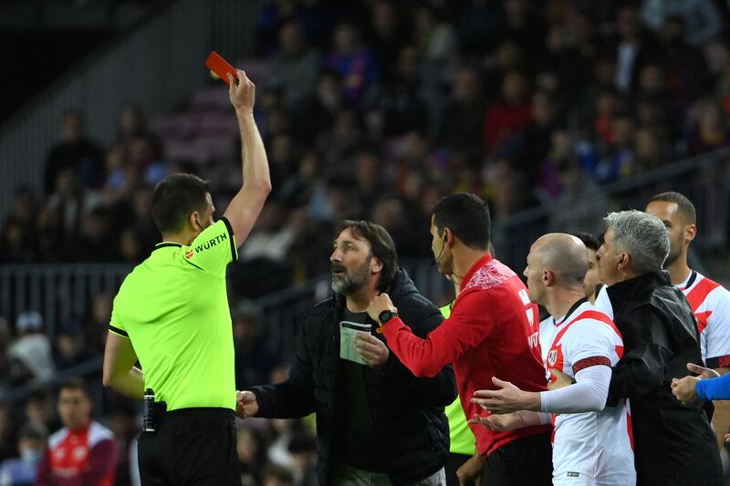 Rayo Vallecano's staff members react as the referee gives a red card to Rayo Vallecano coach Andoni Iraola (not pictured). AFP