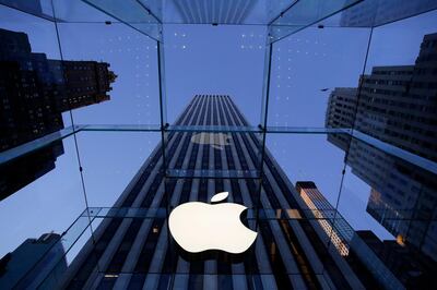 FILE - In this Sept. 5, 2014, file photo, the Apple logo hangs in the glass box entrance to the company's Fifth Avenue store in New York.  Companies like Apple and Walt Disney as well as Walmart's philanthropic foundation are investors in a $23 million venture fund aiming to use tools like artificial intelligence and blockchain technology to improve global labor practices. Working Capital was launched Tuesday, Jan. 30, 2018  by Humanity United, a foundation that's part of the Omidyar Group started by the founder of eBay, Pierre Omidyar. (AP Photo/Mark Lennihan, File)