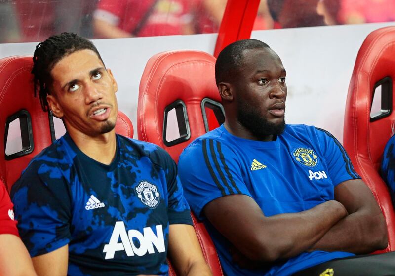Manchester United players Chris Smalling, left, (L) and Romelu Lukaku sit on the bench during the International Champions Cup  match against Inter Milan at the National Stadium in Singapore. EPA