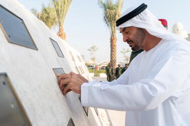 MAHWI, UNITED ARAB EMIRATES - September 04, 2019: HH Sheikh Mohamed bin Zayed Al Nahyan, Crown Prince of Abu Dhabi and Deputy Supreme Commander of the UAE Armed Forces, places a memorial plaque during the inauguration of the Presidential Guard Martyrs Park, at Mahwi Military Camp. ( Rashed Al Mansoori / Ministry of Presidential Affairs ) ---