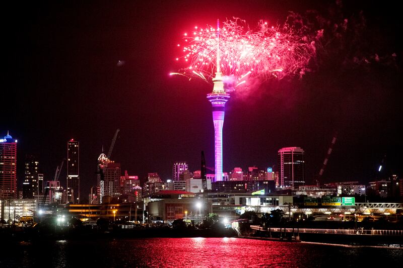Fireworks explode over the Sky Tower in Auckland, as celebrations begin in New Zealand. AP