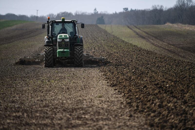 Earth Overshoot Day is the time of year by which people have used up all the resources that ecosystems can sustainably regenerate in one year. Here a farmer prepares a field for rapeseed oil crops in Itchingfield, south England. March 28, 2022. AFP