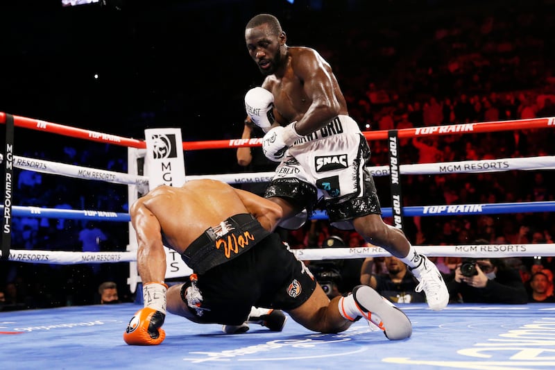 Terence Crawford knocks down Shawn Porter during the 10th round. AP Photo