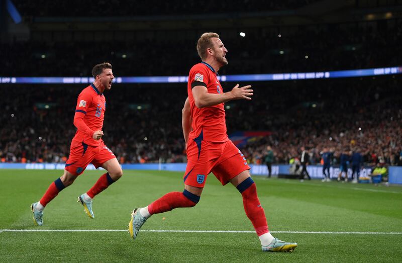 England's Harry Kane celebrates with Mason Mount after scoring the third goal in the 3-3 Nations League draw with Germany at Wembley Stadium on September 26, 2022. Getty