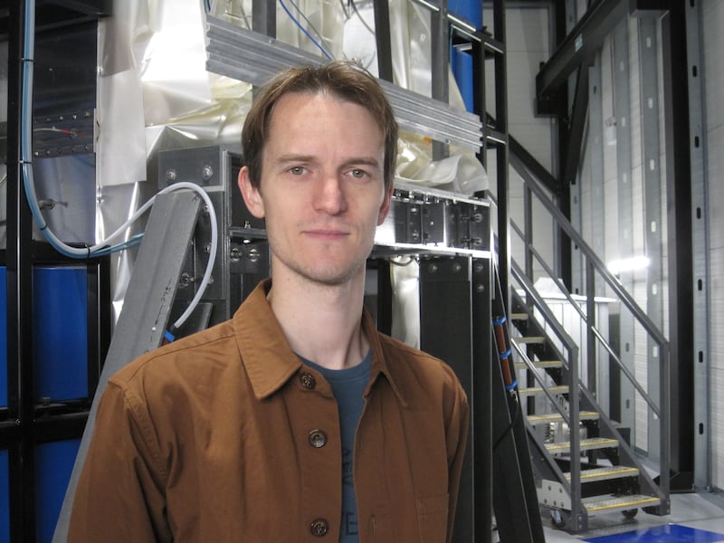 Dr Nick Hawker, First Light Fusion's co-founder and chief executive, in front of M3 (Machine 3) at the company's headquarters in Kidlington, Oxfordshire. Daniel Bardsley for The National