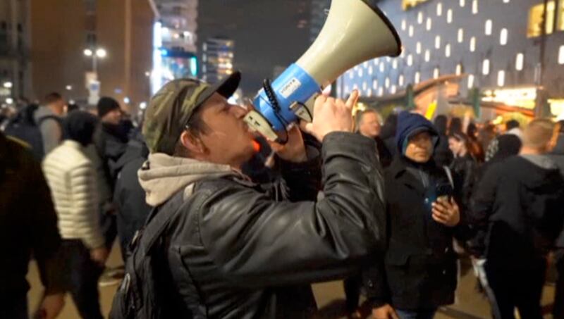 Demonstrators protest against government restrictions. Photo: Media TV Rotterdam via AP