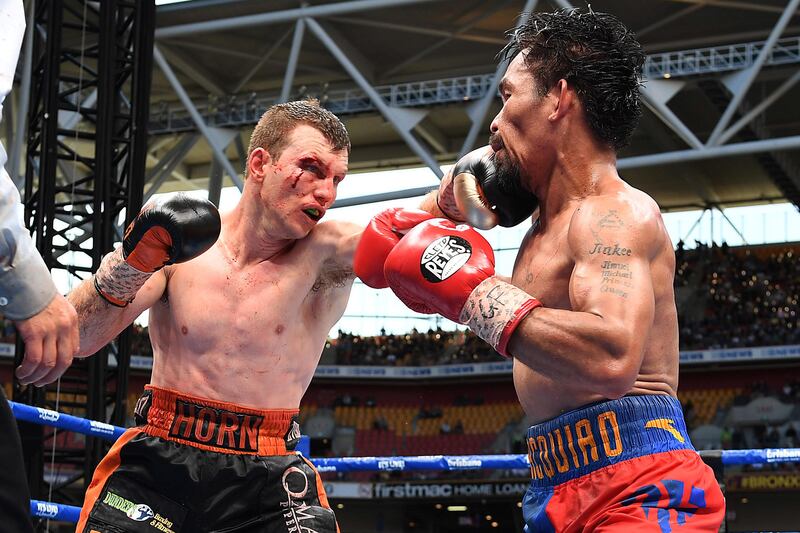 Jeff Horn lands a jab on Manny Pacquiao during their fight in Brisbane on Sunday morning. Dave Hunt / Reuters