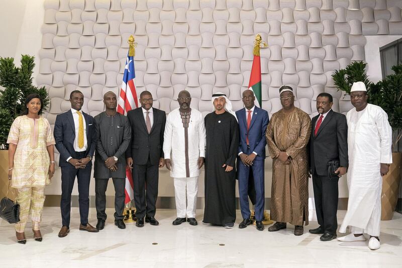 AL MARYAH ISLAND, ABU DHABI, UNITED ARAB EMIRATES - March 19, 2019: HH Sheikh Mohamed bin Zayed Al Nahyan, Crown Prince of Abu Dhabi and Deputy Supreme Commander of the UAE Armed Forces (6th L), stands for a photograph with HE George Weah, President of Liberia (5th L), and accompanying delegation after a dinner meeting at Zuma restaurant. 
( Ryan Carter / Ministry of Presidential Affairs )?
---