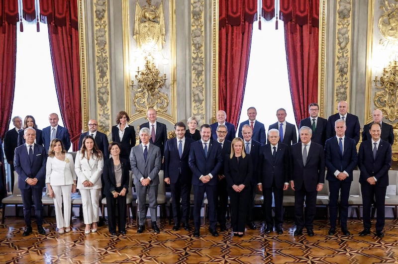 Mr Mattarella, fourth right, and Ms Meloni, fifth right, with members of the new Cabinet. AFP