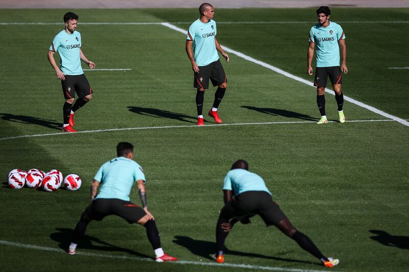 Left to right: Diogo Jota, Pepe and Goncalo Guedes at training. EPA