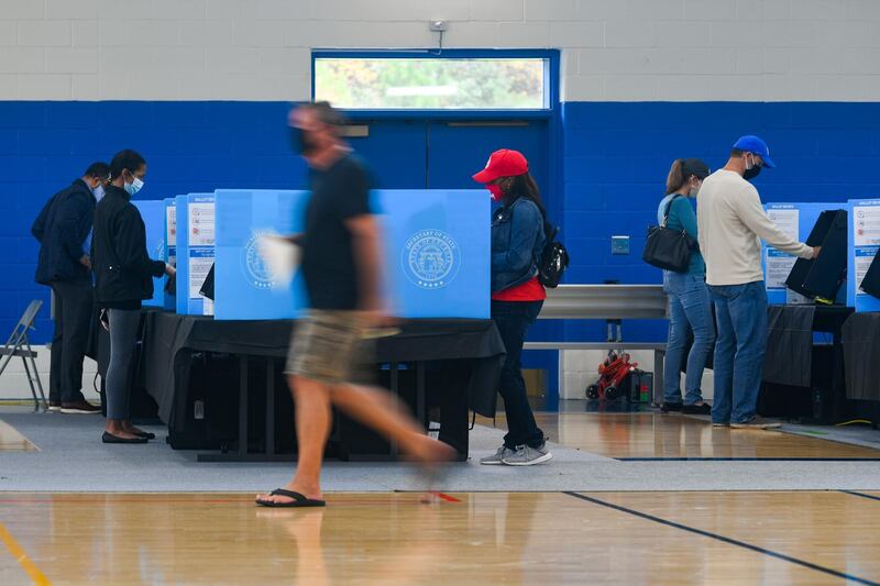 Voters cast ballots as the first day of early voting is underway at the George Pierce Park in Suwanee, Georgia, USA.  EPA