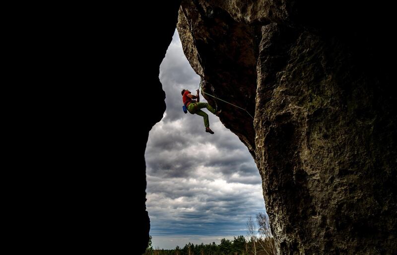 A climber makes his way up the Great Window in Piaseczno, Poland, on Sunday, April 11. EPA