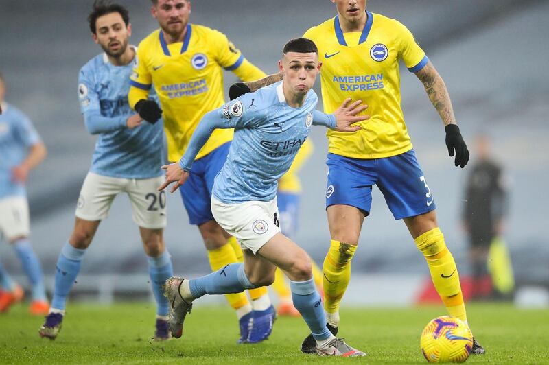 Manchester City's English midfielder Phil Foden on the ball during the English Premier League football match between Manchester City and Brighton and Hove Albion at the Etihad Stadium in Manchester, north west England, on January 13, 2021. RESTRICTED TO EDITORIAL USE. No use with unauthorized audio, video, data, fixture lists, club/league logos or 'live' services. Online in-match use limited to 120 images. An additional 40 images may be used in extra time. No video emulation. Social media in-match use limited to 120 images. An additional 40 images may be used in extra time. No use in betting publications, games or single club/league/player publications.
 / AFP / POOL / Clive Brunskill / RESTRICTED TO EDITORIAL USE. No use with unauthorized audio, video, data, fixture lists, club/league logos or 'live' services. Online in-match use limited to 120 images. An additional 40 images may be used in extra time. No video emulation. Social media in-match use limited to 120 images. An additional 40 images may be used in extra time. No use in betting publications, games or single club/league/player publications.
