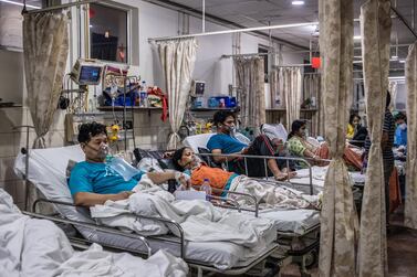 Covid-19 patients inside the emergency ward of a Covid-19 hospital in New Delhi, India. Getty