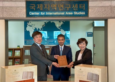 Sharjah Book Authority chairman Ahmed Al Ameri presents officials from South Korea's Institute of Arab Studies at Hankuk University of Foreign Studies the completed volumes of the Historical Corpus of the Arabic Language. Photo: Sharjah Book Authority