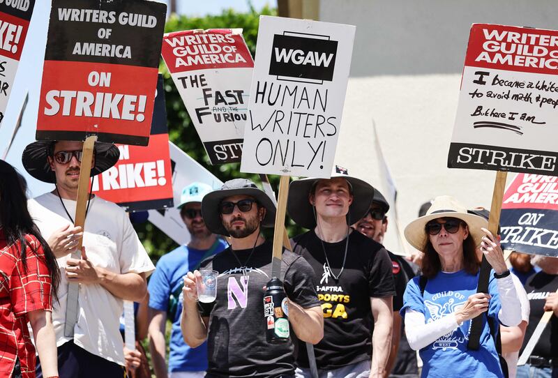 Striking Writers Guild of America workers picket outside Paramount Studios. Getty via AFP