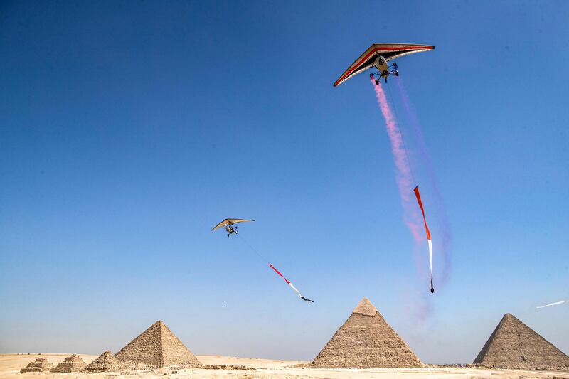 'Ultralight trikes' fly during the Pyramids Air Show. 