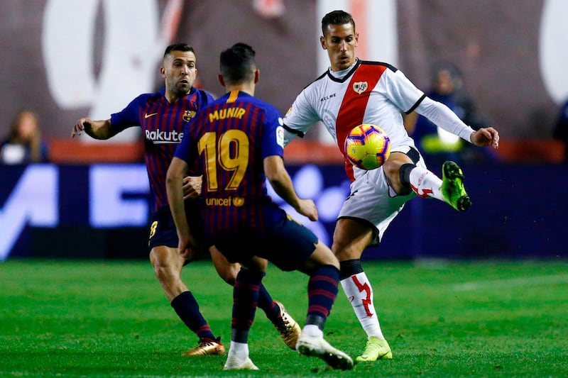 Rayo Vallecano's Alex Alegria challenges Barcelona's Jordi Alba. AFP