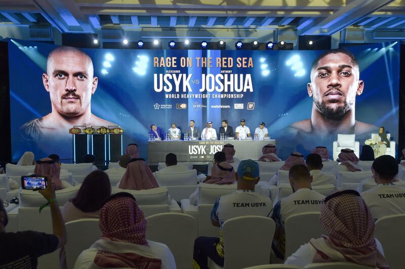 Ukraine's Oleksandr Usyk, president of the Saudi Boxing Federation Abdullah Ahmed Eid al-Harbi and Britain's Anthony Joshua attend the press conference. AFP