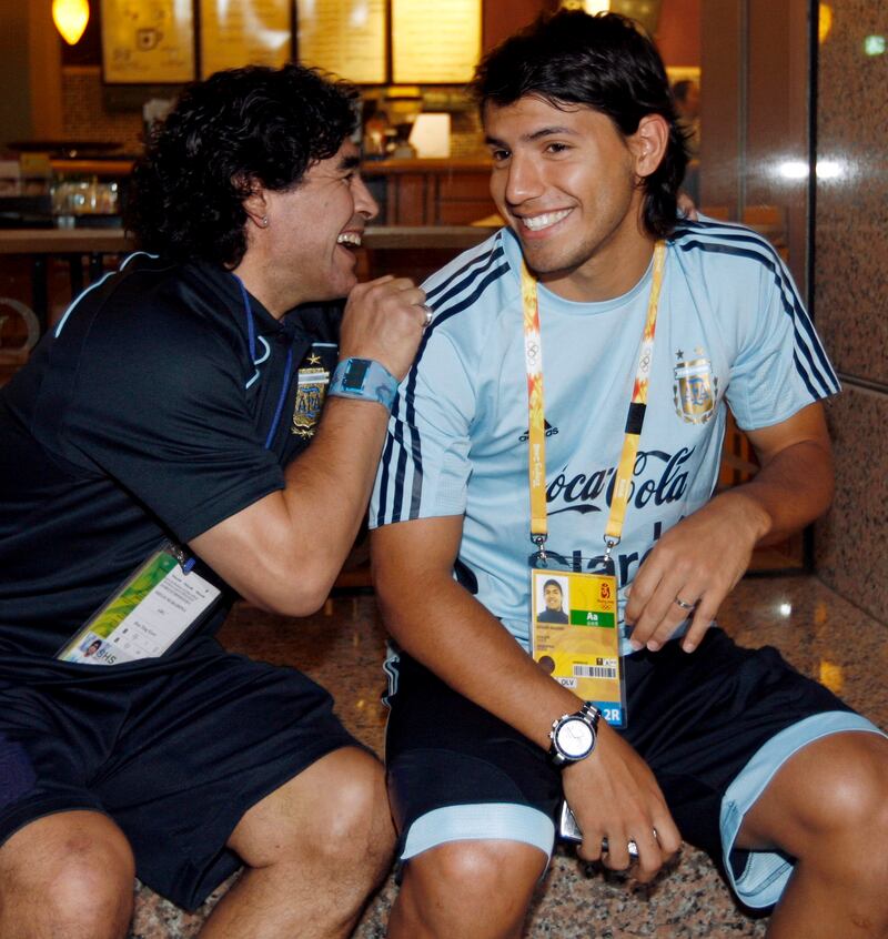 Arentina legend Diego Maradona and Sergio Aguero speak during the 2008 Beijing Olympic Games. EPA