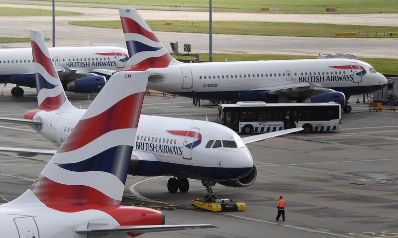 epa08749895 (FILE) - British Airways passenger aircraft at Heathrow Airport Terminal Five in London, Britain, 14 March 2020 (reissued 16 October 2020). Britain's flagship aircraft carrier British Airways was on 16 October 2020 fined by the British Information Commissioner's Office, IOC, 20 million pound for 'failing to protect the personal and financial details of more than 400,000 of its customers', and processing 'personal data without adequate security measures in place' as the authority stated.  EPA/ANDY RAIN *** Local Caption *** 55952677