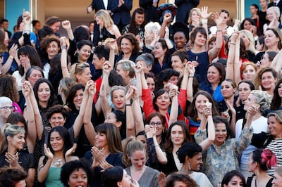 epa06731350 Actresses and female directors stand on the steps of the red carpet in protest of the lack of female filmmakers honored throughout the history of the festival at the screening of 'Girls of the Sun (Les Filles du Soleil)' during the 71st annual Cannes Film Festival, in Cannes, France, 12 May 2018. The movie is presented in the Official Competition of the festival which runs from 08 to 19 May.  EPA/FRANCK ROBICHON