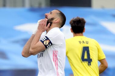 epa09220818 Real Madrid' French striker Karim Benzema (L) celebrates after scoring the 1-1 goal during the Spanish LaLiga Primera Division soccer match between Real Madrid and Villarreal at Alfredo Di Stefano stadium in Madrid, central Spain, 22 May 2021. EPA/Eduardo Candel