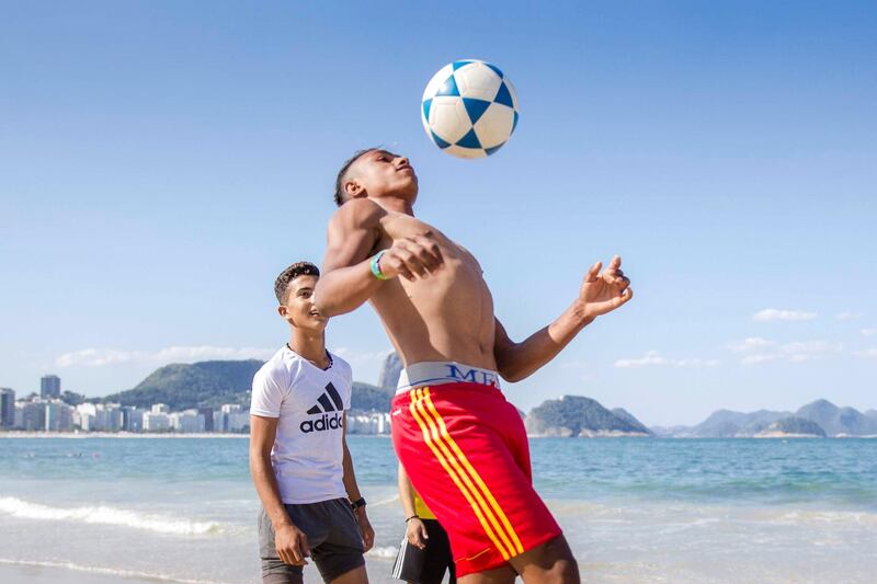 Hafeth Al Mohammed shows of his newly honed football skills on the beach. Courtesy Viva Rio