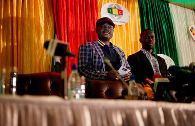 Spokesperson of the opposition party Movement for Democratic Change (MDC) Morgan Komichi (L) addresses media representatives to denounce the election's vote count as "fake", moments before the official announcement of the results and before being removed by police, on the stage of the Zimbabwe Election Commission (ZEC) in Harare on August 2, 2018.
                       
Zimbabwe's opposition leader Chamisa on August 3 dismissed what he called the "unverified fake results" of the election which handed victory to President Mnangagwa. / AFP PHOTO / Zinyange AUNTONY