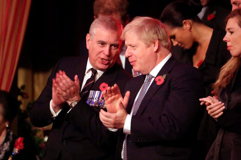 Prince Andrew, Duke of York, and Prime Minister Boris Johnson talk in the royal box. AFP