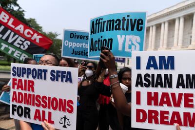 Protestors demonstrate outside the Supreme Court in Washington. AP