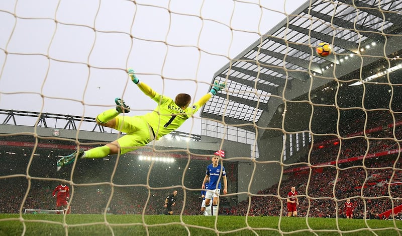 LIVERPOOL, ENGLAND - DECEMBER 10:  Jordan Pickford of Everton dives, as Mohamed Salah of Liverpool (not pictured) scores his side's first goal during the Premier League match between Liverpool and Everton at Anfield on December 10, 2017 in Liverpool, England.  (Photo by Clive Brunskill/Getty Images)