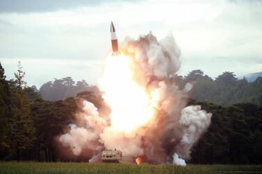 North Korea's official Korean Central News Agency (KCNA) shows the test-firing of a new weapon, presumed to be a short-range ballistic missile, at an undisclosed location AFP