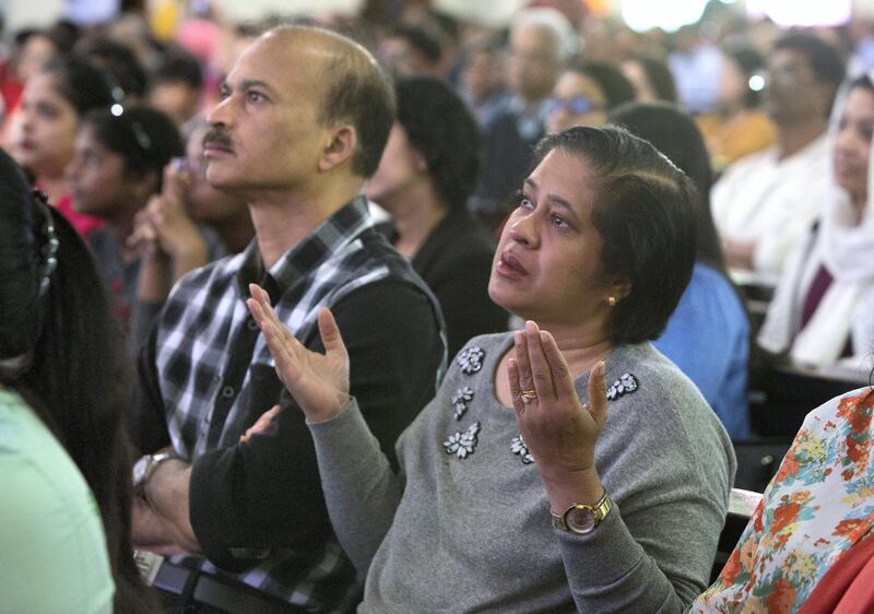 DUBAI, UNITED ARAB EMIRATES - Worshippers are emotional upon seeing the Pope on the screen at St. Mary's Church, Oud Mehta.  Leslie Pableo for The National for Nick Webster's story