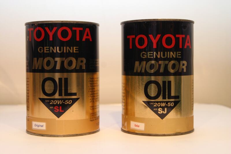 DUBAI, UNITED ARAB EMIRATES - February 4:  Counterfeit (pictured right) and genuine Toyota motor oil on display at the Hemaya Universal stand during the 4th Global Conference on Combating Counterfeiting & Piracy, held at the Madinat Jumeirah Conference Hall, Dubai, on February 4, 2008, (Photo by Randi Sokoloff / ADMC)