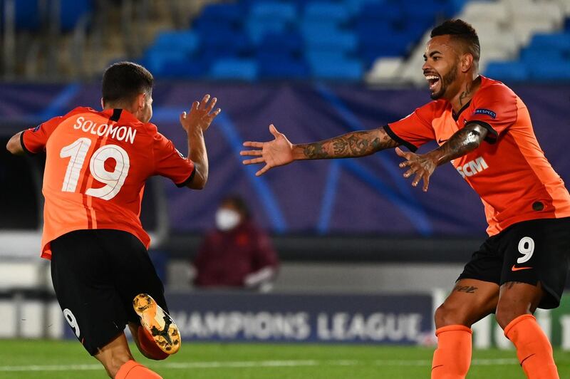 Shakhtar Donetsk's Manor Solomon (L) celebrates with  Dentinho after scoring his team's third goal. AFP