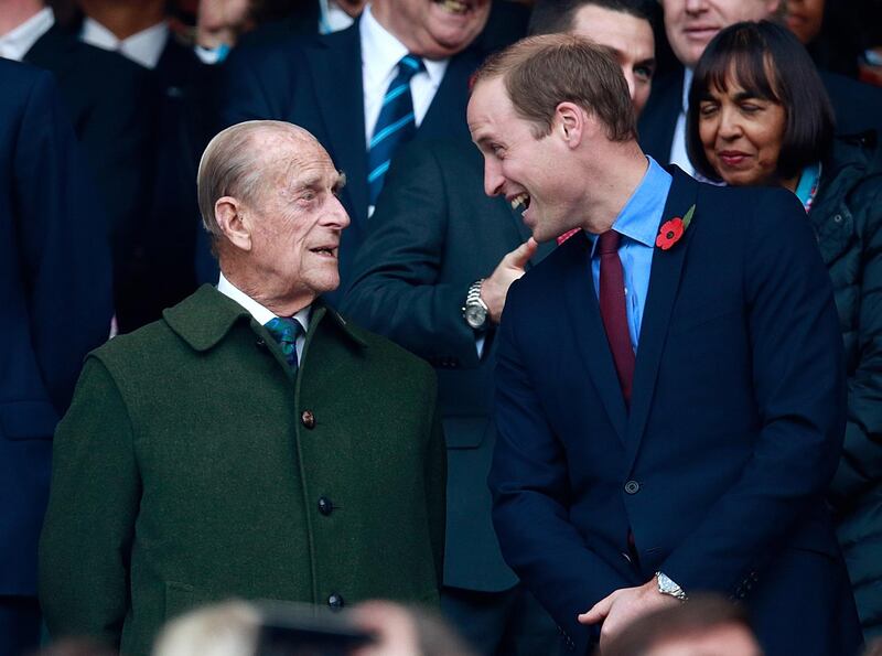 LONDON, ENGLAND - OCTOBER 31:  (EDITORS NOTE: Retransmission of #495101722 with alternate crop.)  Prince Phillip and Prince William enjoy the build up to the 2015 Rugby World Cup Final match between New Zealand and Australia at Twickenham Stadium on October 31, 2015 in London, United Kingdom.  (Photo by Phil Walter/Getty Images)