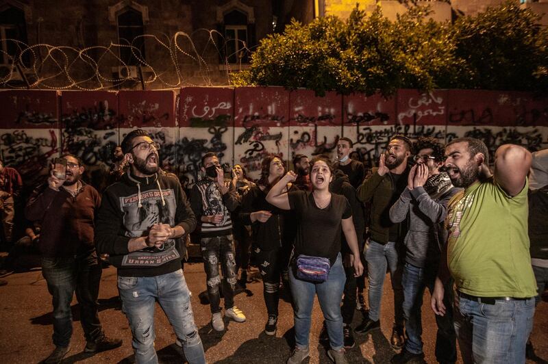 Anti-government protesters shout slogans during a protest against the collapsing Lebanese currency and the price hikes of goods, in front the central bank in Beirut, Lebanon.  EPA